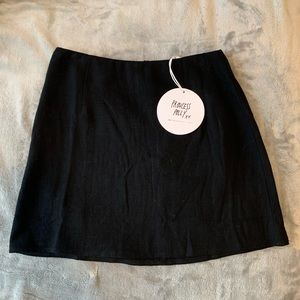 A classic black mini skirt from princess polly with a zipper in the back.